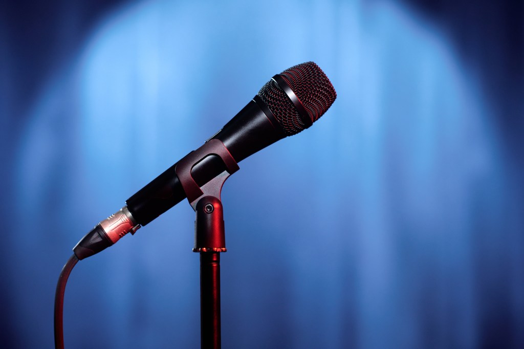Microphone on stage highlighting Dawn Stallwoods ability to speak on stage at events